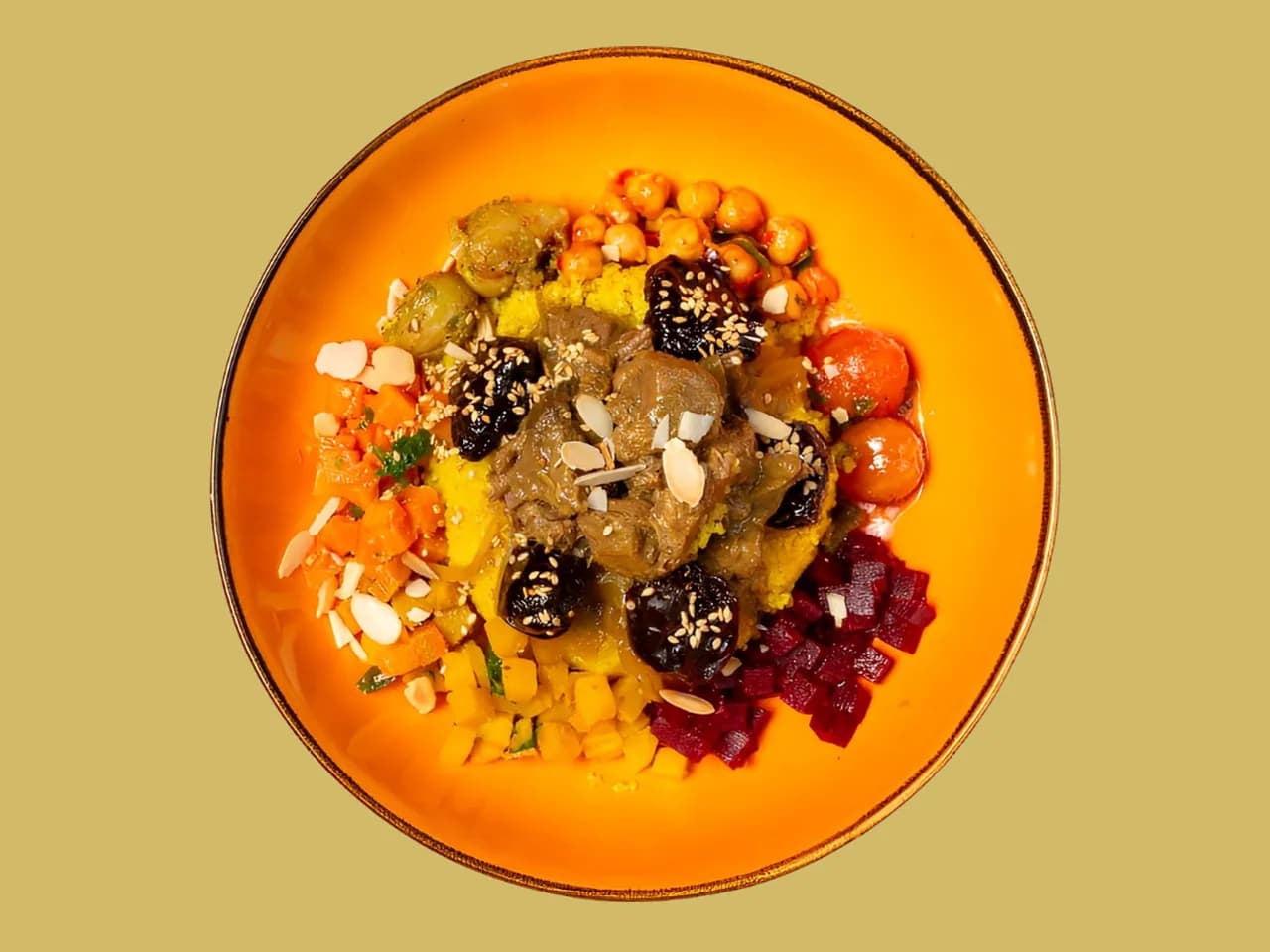 Thousand and One Night Bowl from above: braised beef, chickpeas and almonds on an orange plate