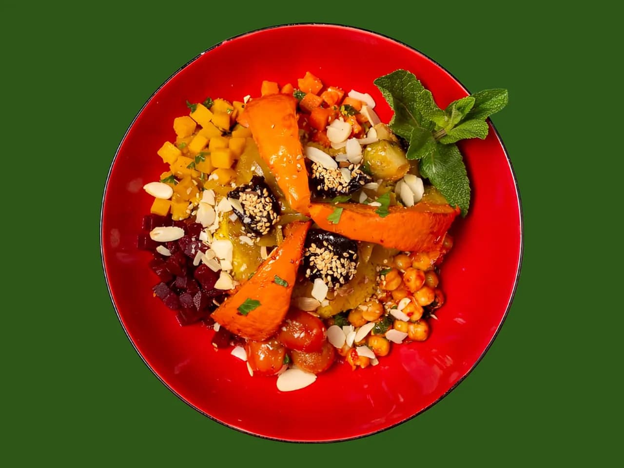 Berber Bowl from above: seasonal vegetables and almonds on a red plate