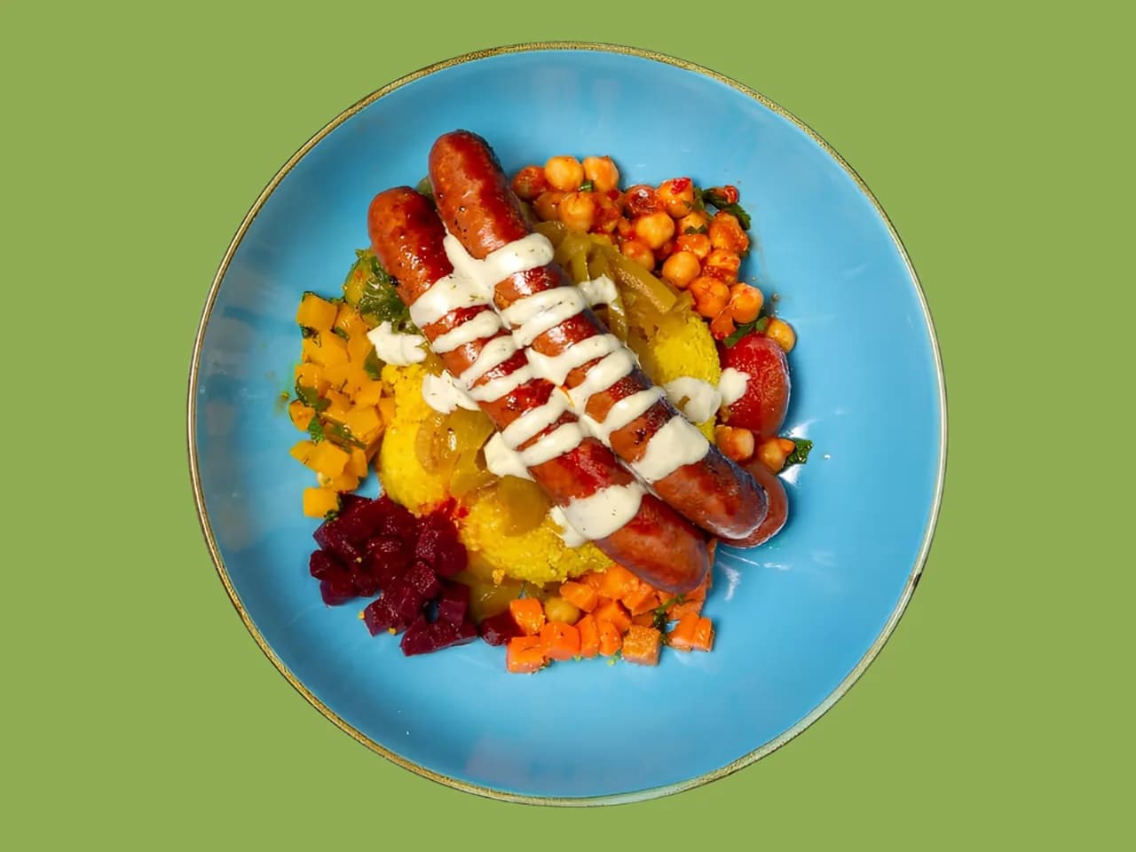 Sahara Soul Bowl from above: lamb merguez with chickpeas and a dish of harissa beside it
